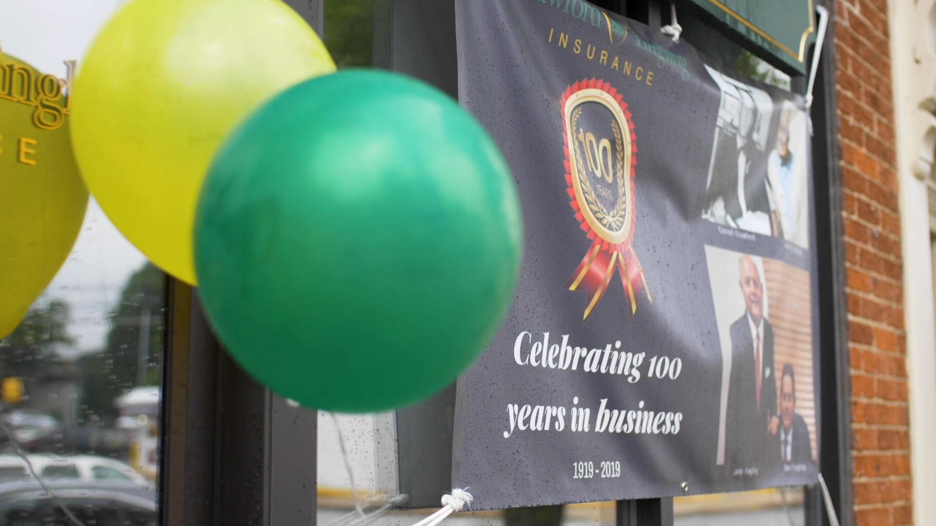 celebrating-100-years-balloons-green-yellow